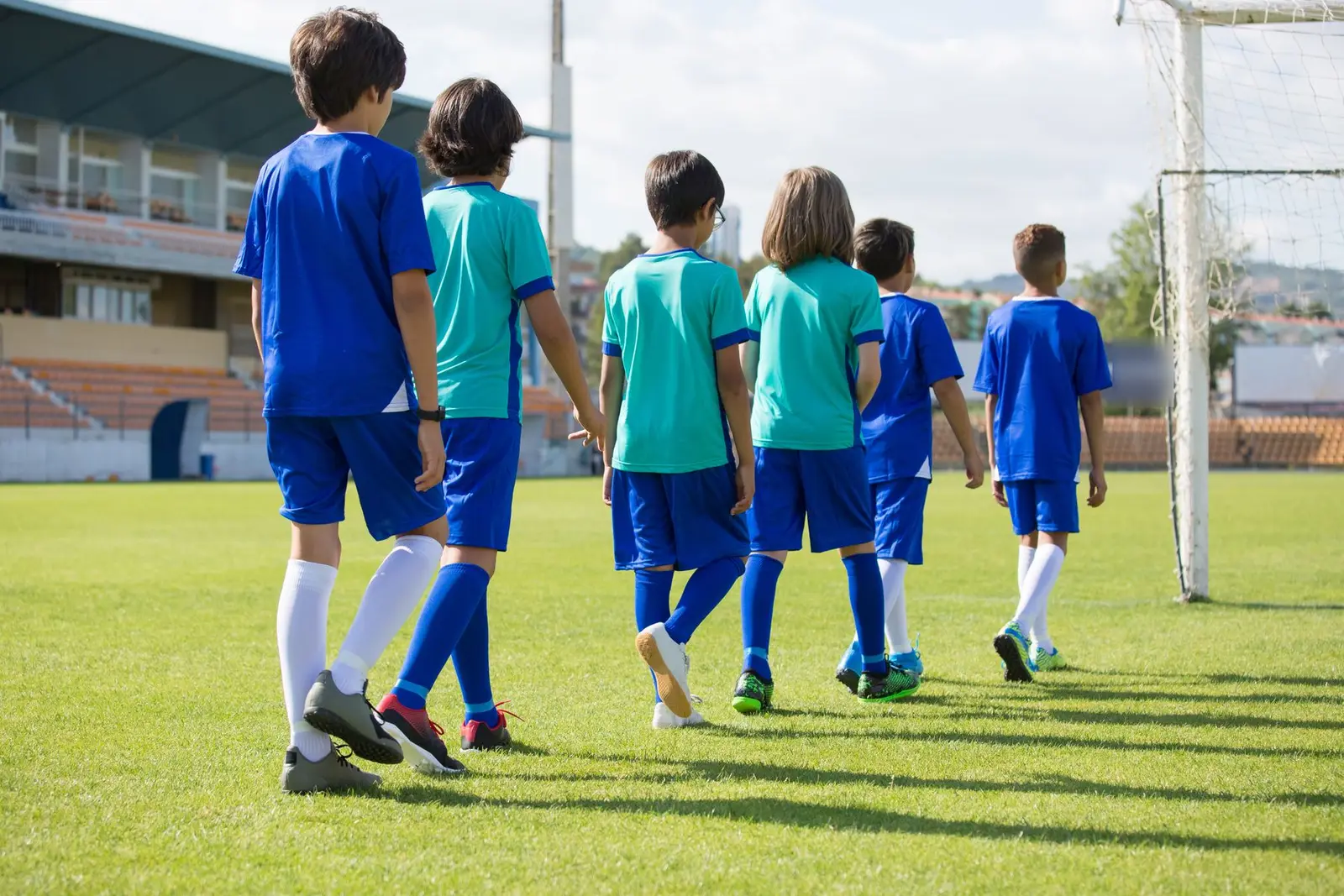 Junior sports team in matching kit, seen from behind
