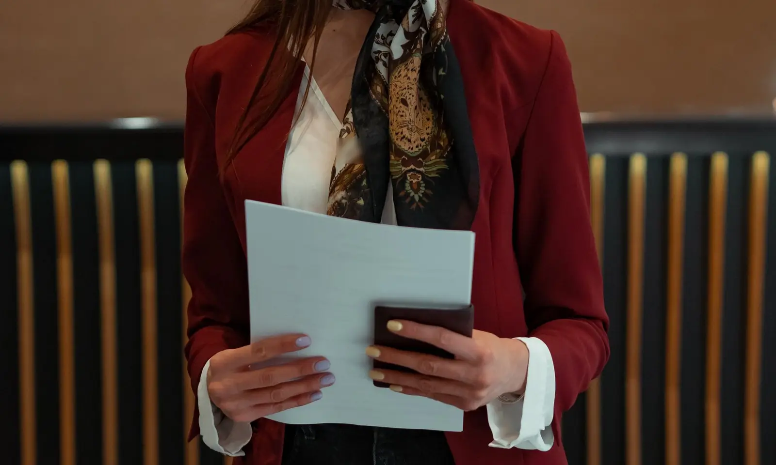Front-desk staff member in a blazer