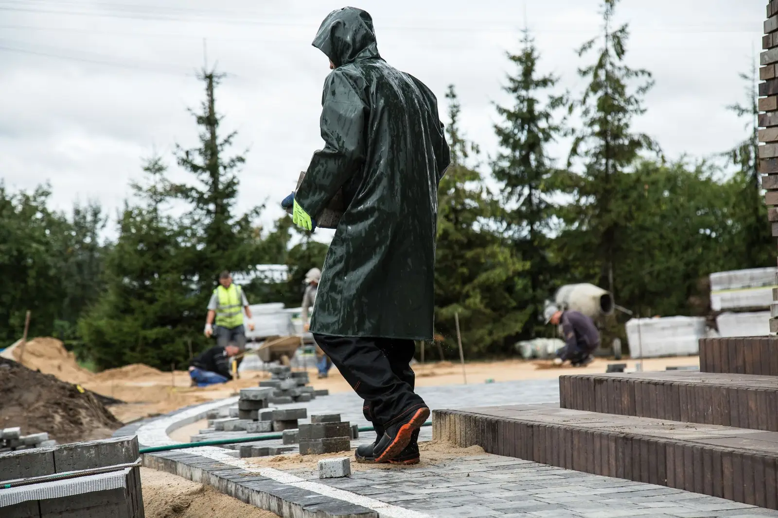 Rain jacket and safety boots on a work site