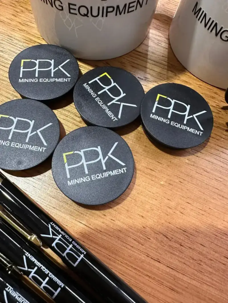 Branded round badges and pens