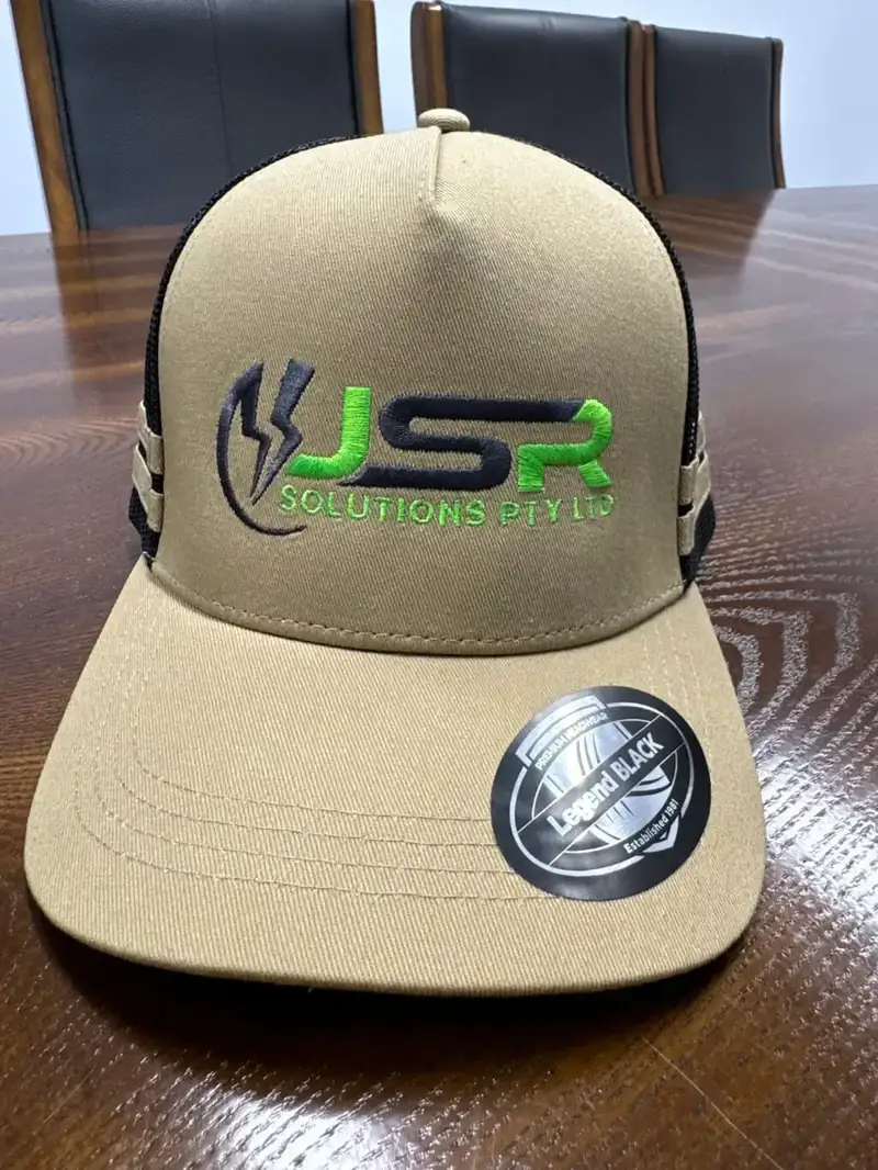 Embroidered cap with a green and black logo