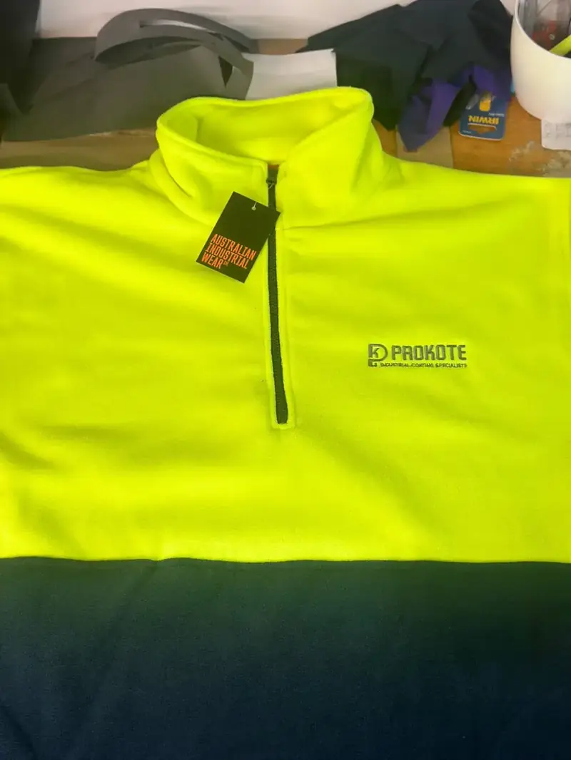 Hi-vis jacket with an embroidered chest logo
