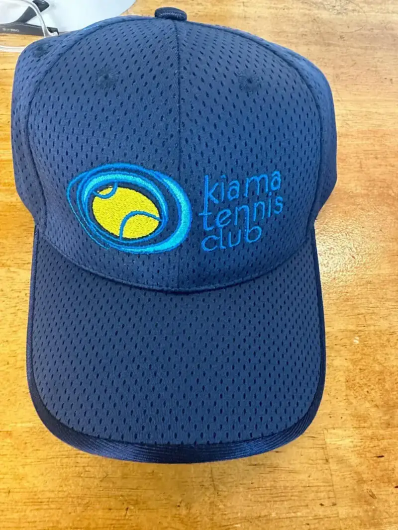 Blue mesh cap embroidered with a tennis club logo