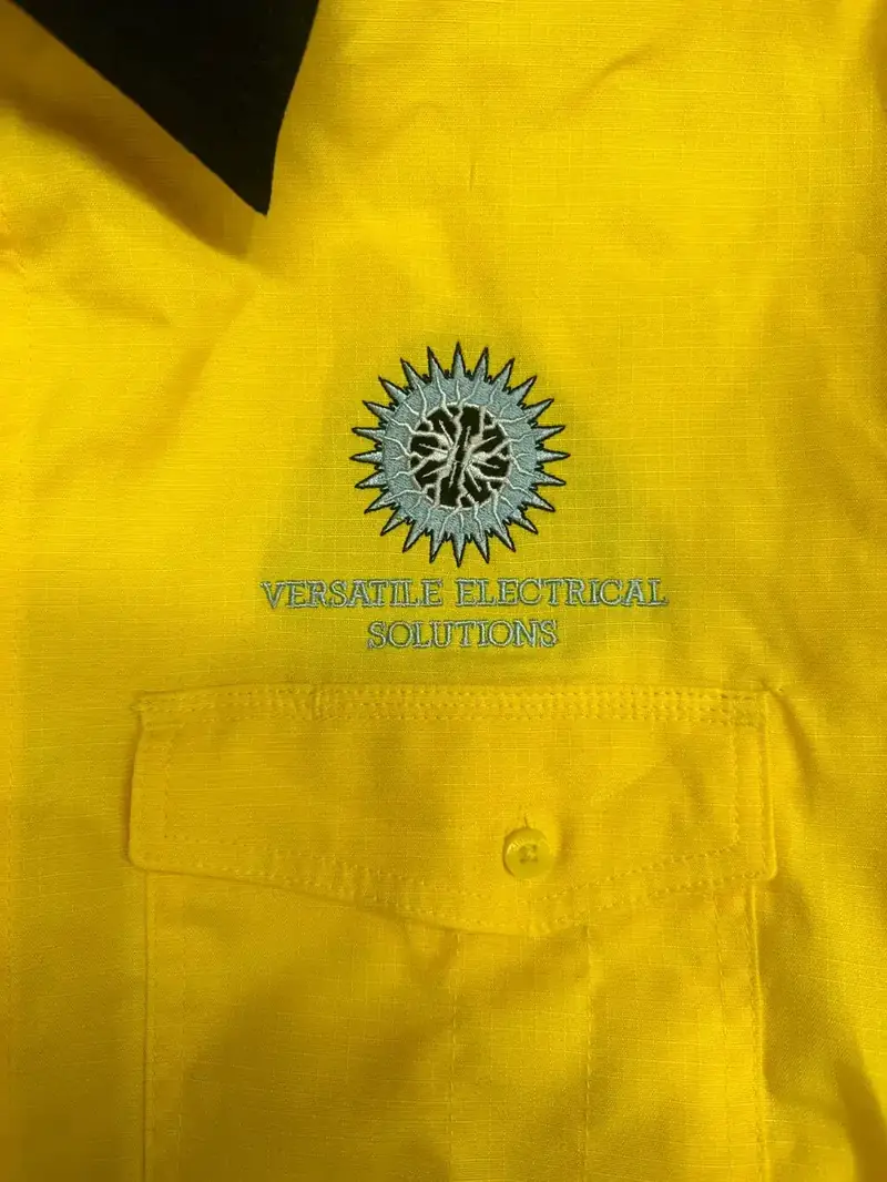 Yellow polo with an embroidered company logo